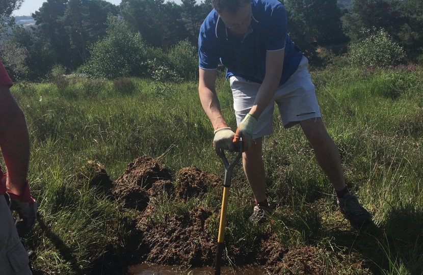 Michael digging a pond