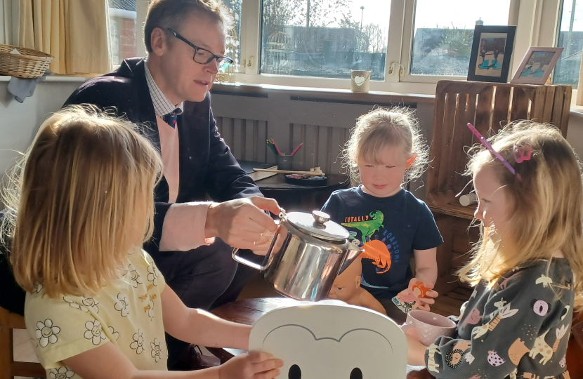 Michael with small children at nursery