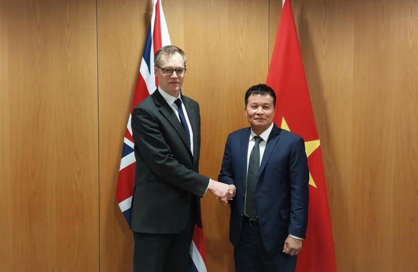 Michael shaking hands with Vietnamese Colonel