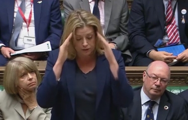 Penny Mordaunt using sign language