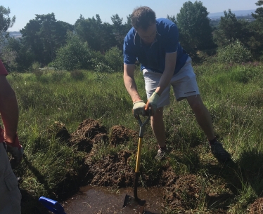 Michael digging a pond