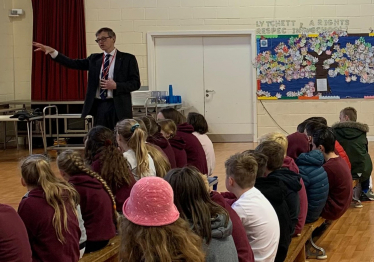 Michael speaking to pupils